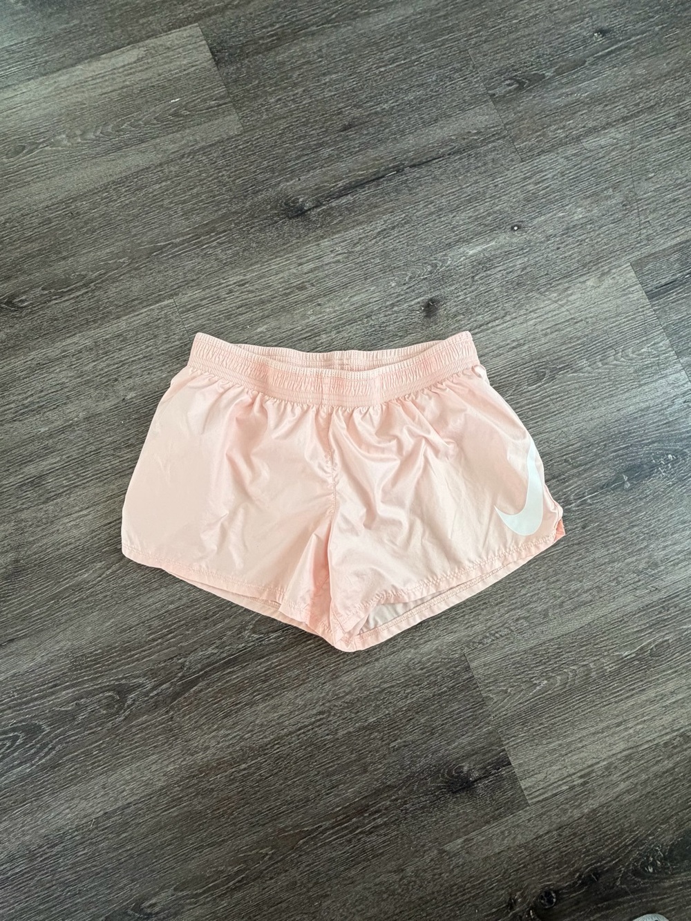Nike Women's Light Pink Athletic Shorts with White Swoosh